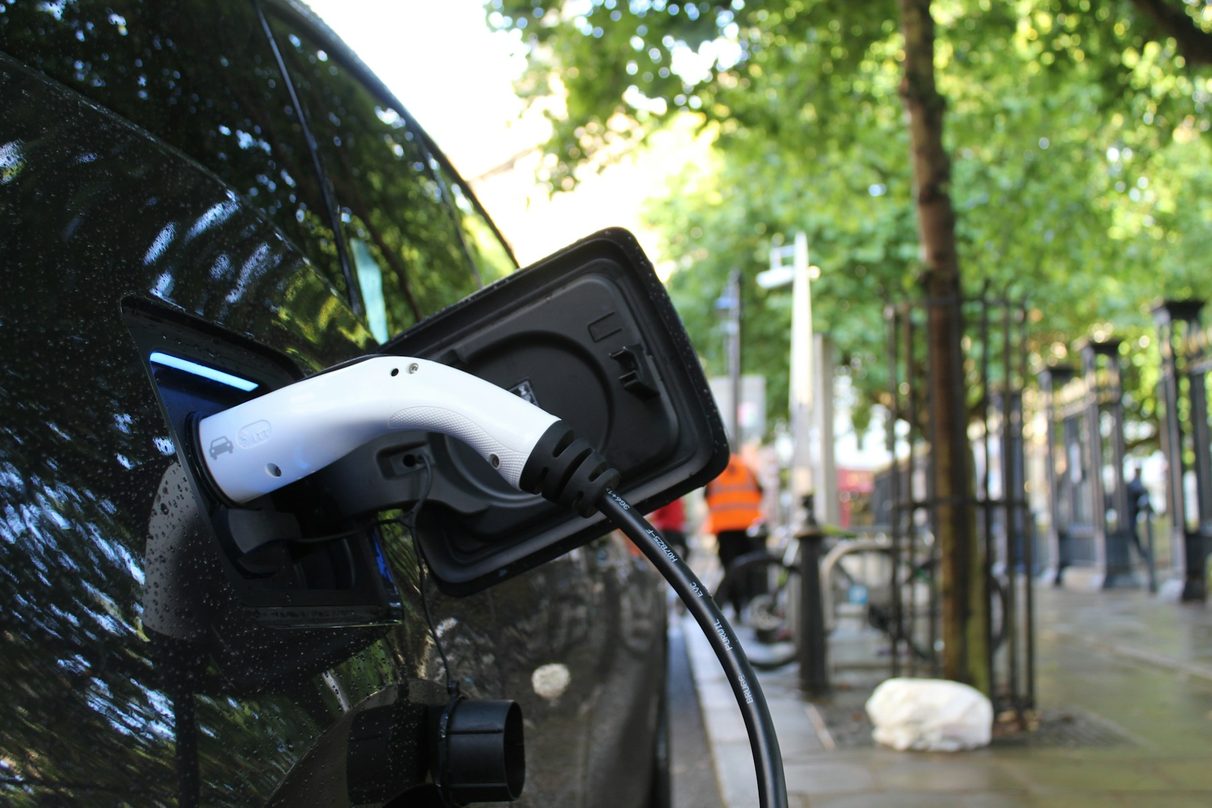 Electric vehicle charging cable connected outdoors